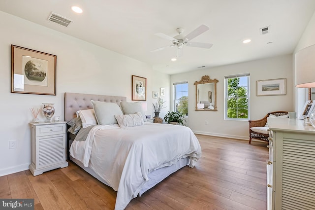 bedroom featuring light wood-type flooring, recessed lighting, baseboards, and ceiling fan
