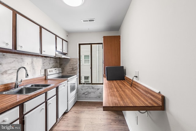 210 Trimper Ave Unit 8, Ocean City, MD 21842 - kitchen with a sink, white appliances, under cabinet range hood, light wood finished floors, and baseboards