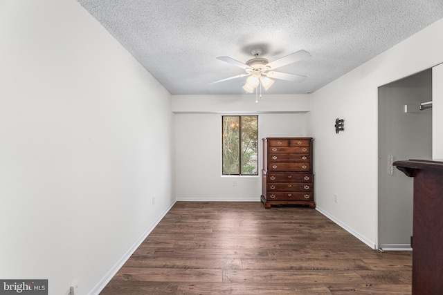 210 Trimper Ave Unit 8, Ocean City, MD 21842 - unfurnished bedroom with wood finished floors, a textured ceiling, baseboards, and a ceiling fan