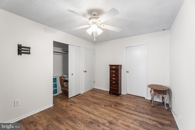 210 Trimper Ave Unit 8, Ocean City, MD 21842 - bedroom with wood finished floors, a textured ceiling, a ceiling fan, a closet, and baseboards