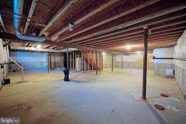 unfinished basement with stairs