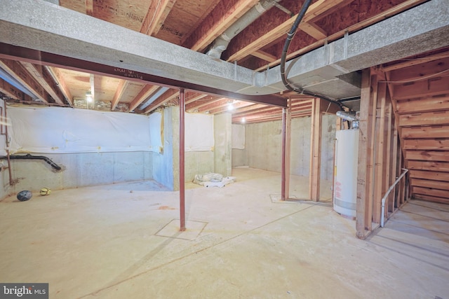 unfinished basement featuring water heater