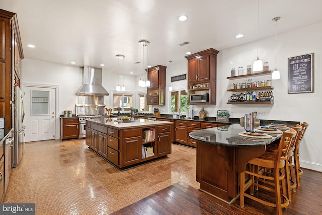 94 Tomahawk Way, Linden, VA 22642 - kitchen with wall chimney range hood, open shelves, appliances with stainless steel finishes, a peninsula, and recessed lighting
