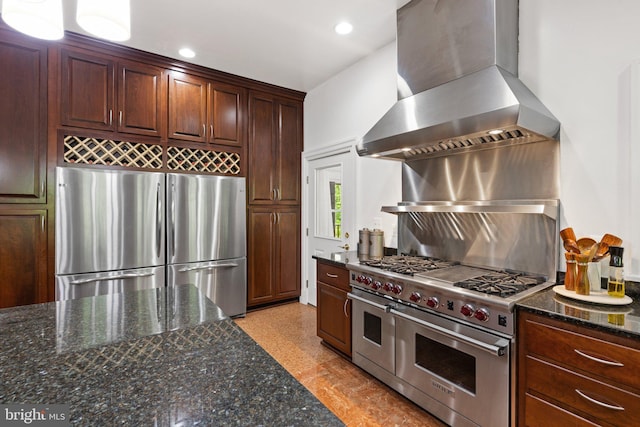 94 Tomahawk Way, Linden, VA 22642 - kitchen with stainless steel appliances, wall chimney exhaust hood, dark stone countertops, recessed lighting, and tasteful backsplash