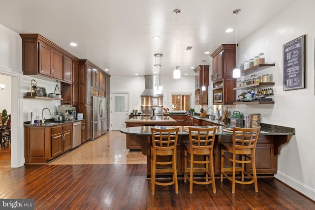 94 Tomahawk Way, Linden, VA 22642 - kitchen featuring open shelves, wall chimney exhaust hood, a peninsula, stainless steel appliances, and recessed lighting