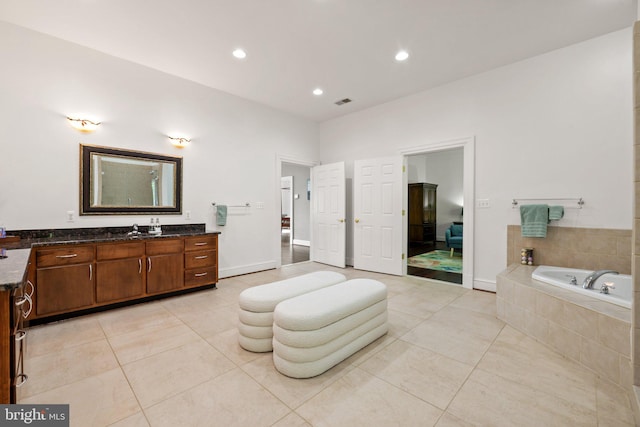 94 Tomahawk Way, Linden, VA 22642 - bathroom with vanity, a garden tub, tile patterned flooring, recessed lighting, and baseboards