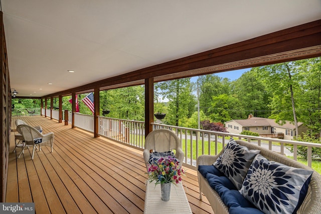 94 Tomahawk Way, Linden, VA 22642 - wooden deck with an outdoor living space and view of wooded area