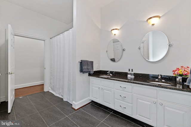 94 Tomahawk Way, Linden, VA 22642 - bathroom with tile patterned flooring, double vanity, baseboards, and a shower with shower curtain