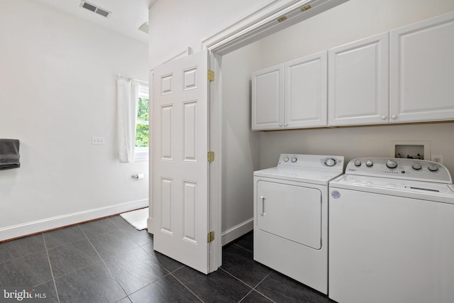 94 Tomahawk Way, Linden, VA 22642 - laundry room featuring cabinet space, washing machine and dryer, baseboards, and dark tile patterned floors