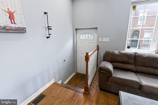 entryway featuring baseboards and wood finished floors