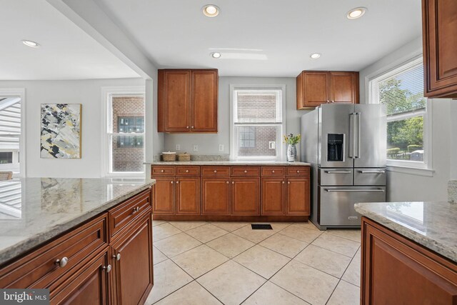 6924 Jefferson Ave, Falls Church, VA 22042 - kitchen with high end fridge, plenty of natural light, light stone counters, and recessed lighting