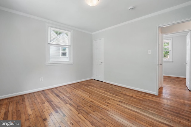 6924 Jefferson Ave, Falls Church, VA 22042 - unfurnished room with ornamental molding, baseboards, healthy amount of natural light, hardwood / wood-style flooring, and a smoke detector