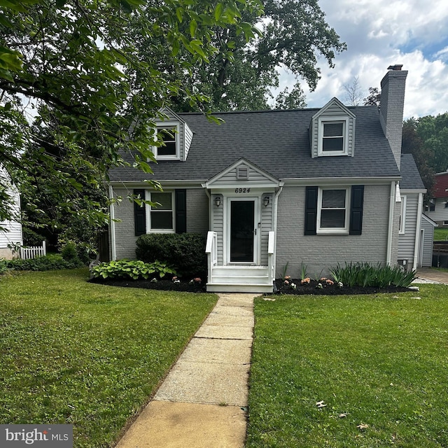 6924 Jefferson Ave, Falls Church, VA 22042 - cape cod-style house with brick siding, a front lawn, a chimney, and roof with shingles