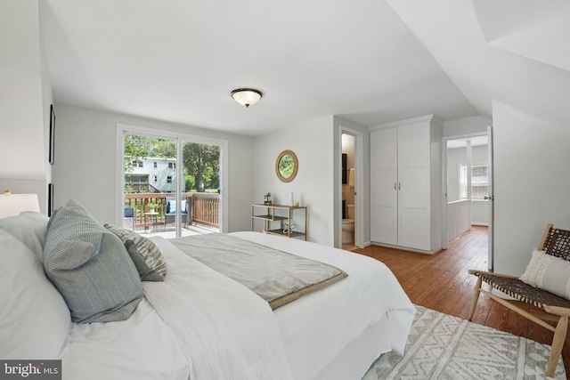 6924 Jefferson Ave, Falls Church, VA 22042 - bedroom with hardwood / wood-style floors, access to exterior, ensuite bathroom, and lofted ceiling