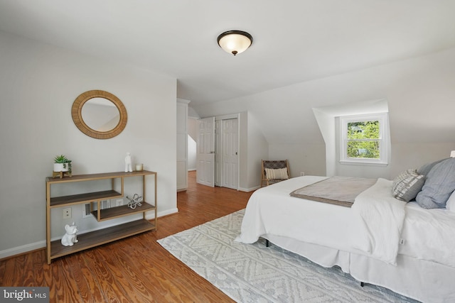 6924 Jefferson Ave, Falls Church, VA 22042 - bedroom featuring wood finished floors, lofted ceiling, baseboards, and a closet