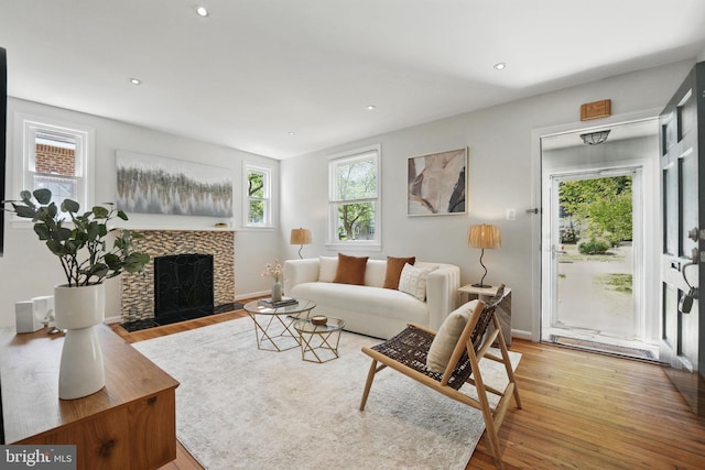 6924 Jefferson Ave, Falls Church, VA 22042 - living area featuring wood finished floors, a fireplace, recessed lighting, and baseboards