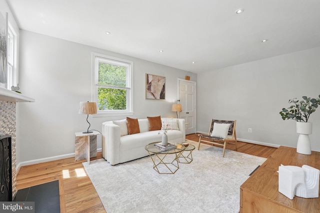 6924 Jefferson Ave, Falls Church, VA 22042 - living room featuring wood finished floors, a fireplace with flush hearth, baseboards, and recessed lighting