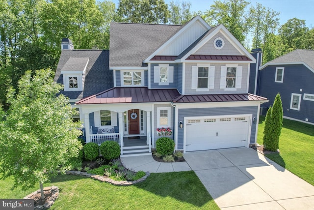 20785 Rodney Dr, Rehoboth Beach, DE 19971 - view of front facade with a standing seam roof, metal roof, a porch, a shingled roof, and driveway