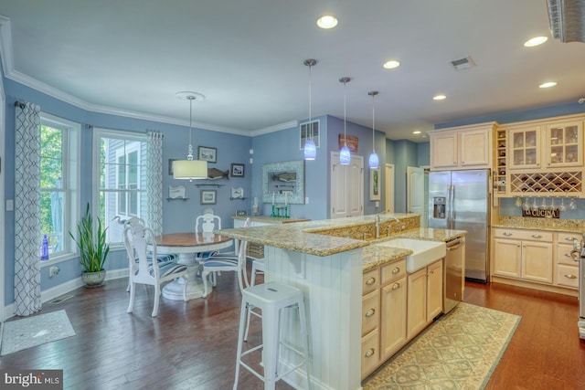 20785 Rodney Dr, Rehoboth Beach, DE 19971 - kitchen featuring appliances with stainless steel finishes, a sink, light brown cabinetry, glass insert cabinets, and crown molding