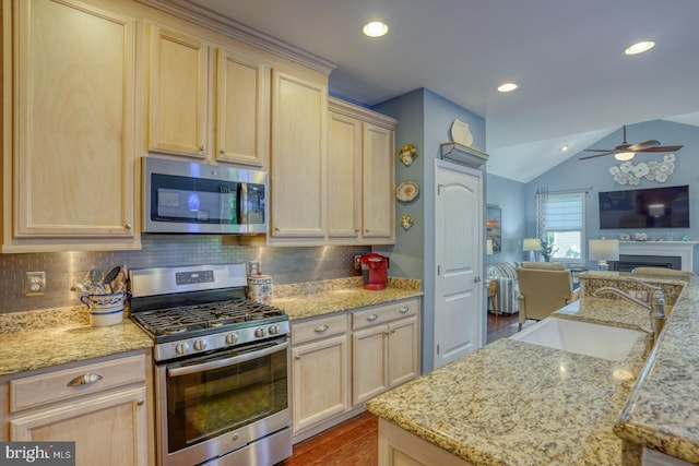 20785 Rodney Dr, Rehoboth Beach, DE 19971 - kitchen with appliances with stainless steel finishes, light brown cabinets, a sink, open floor plan, and a ceiling fan