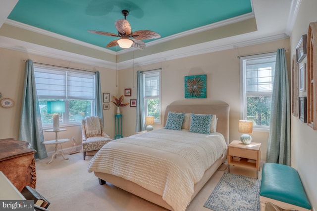 20785 Rodney Dr, Rehoboth Beach, DE 19971 - bedroom with crown molding, carpet floors, a raised ceiling, and ceiling fan