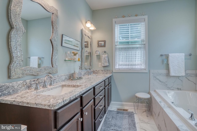 20785 Rodney Dr, Rehoboth Beach, DE 19971 - full bathroom with double vanity, healthy amount of natural light, baseboards, and a garden tub