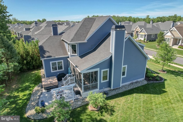 20785 Rodney Dr, Rehoboth Beach, DE 19971 - rear view of house with a chimney, a residential view, and a wooden deck