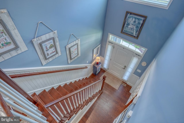 20785 Rodney Dr, Rehoboth Beach, DE 19971 - foyer with wood finished floors, a towering ceiling, and stairs