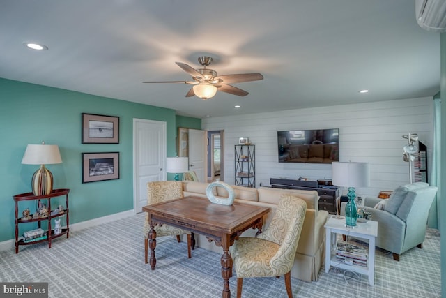 20785 Rodney Dr, Rehoboth Beach, DE 19971 - carpeted living room featuring a ceiling fan, an AC wall unit, wooden walls, recessed lighting, and baseboards