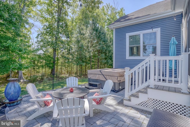 20785 Rodney Dr, Rehoboth Beach, DE 19971 - view of patio with a hot tub and outdoor dining space