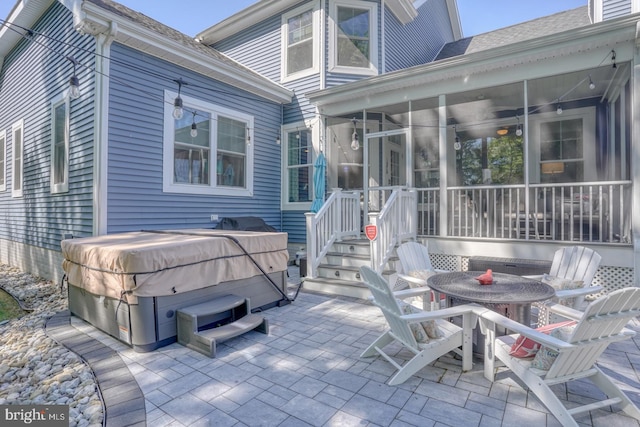 20785 Rodney Dr, Rehoboth Beach, DE 19971 - view of patio / terrace with a hot tub, a sunroom, and outdoor dining area