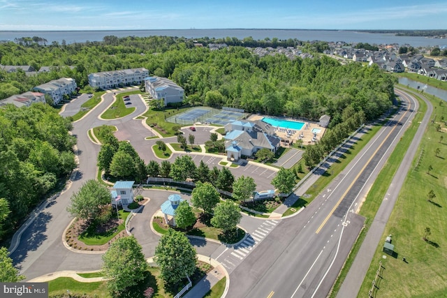 20785 Rodney Dr, Rehoboth Beach, DE 19971 - aerial view of property and surrounding area featuring a pool area and a large body of water