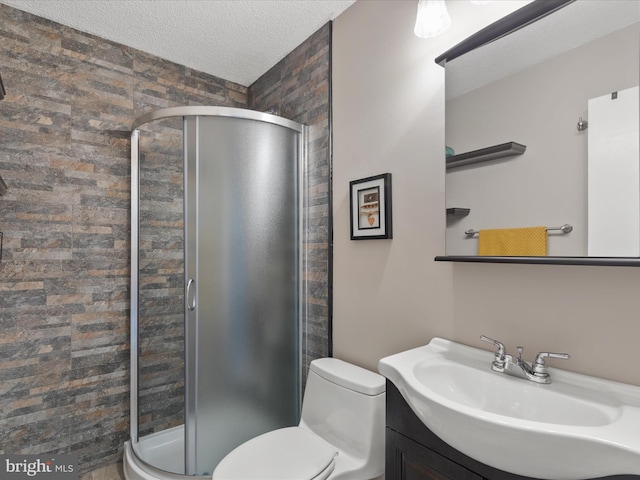 117 76th St Unit 302, Ocean City, MD 21842 - full bathroom featuring a stall shower, vanity, toilet, and a textured ceiling