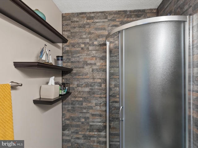117 76th St Unit 302, Ocean City, MD 21842 - full bath featuring a shower stall and a textured ceiling