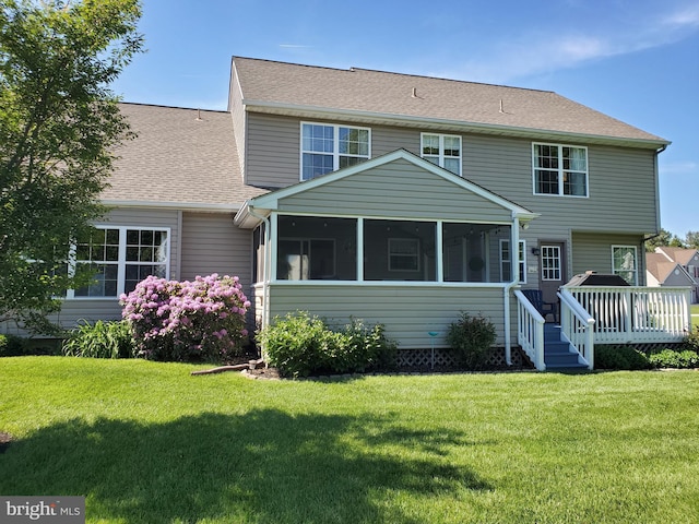 225 Canonero Dr, Bear, DE 19701 - rear view of property with a sunroom, a wooden deck, a lawn, and roof with shingles