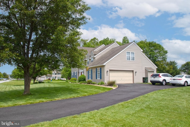 225 Canonero Dr, Bear, DE 19701 - view of front facade featuring asphalt driveway, a front yard, and a shingled roof