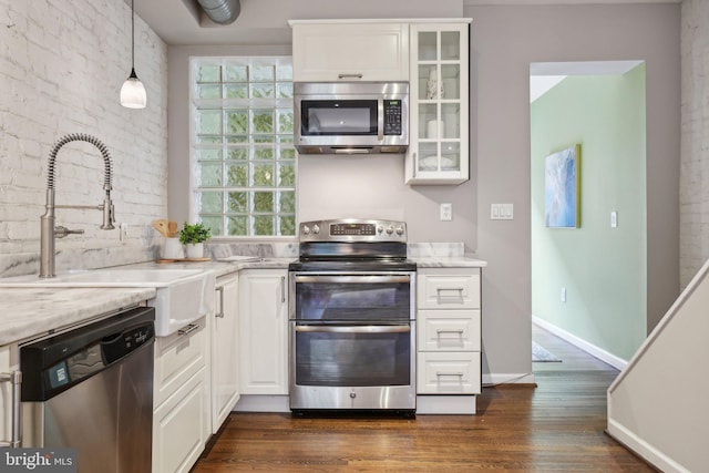 223 Parker St NE, Washington, DC 20002 - kitchen with appliances with stainless steel finishes, dark wood-type flooring, white cabinets, glass insert cabinets, and a sink