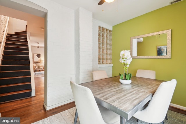 223 Parker St NE, Washington, DC 20002 - dining space with ceiling fan, stairway, wood finished floors, and baseboards