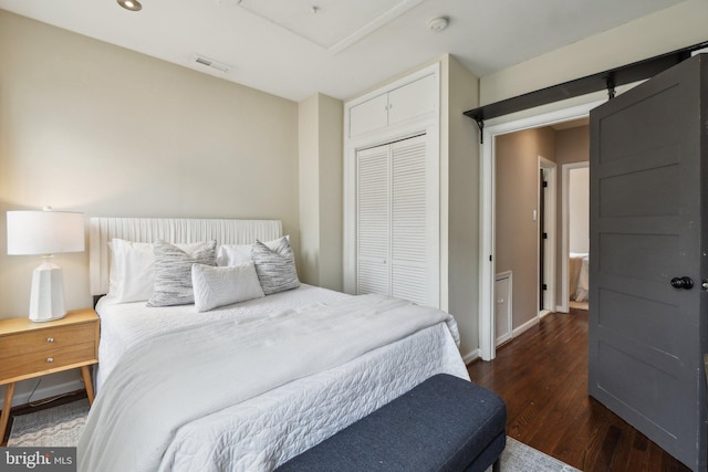 223 Parker St NE, Washington, DC 20002 - bedroom featuring a closet, wood finished floors, and baseboards