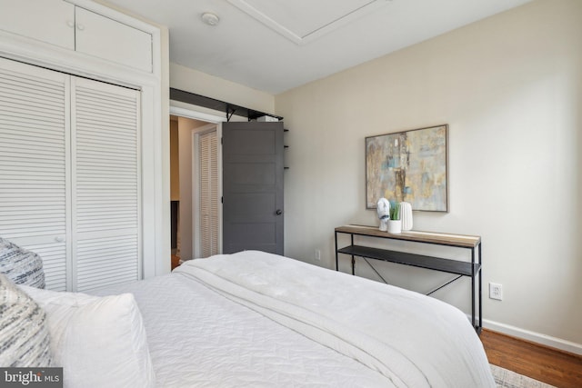 223 Parker St NE, Washington, DC 20002 - bedroom with wood finished floors, baseboards, and a closet