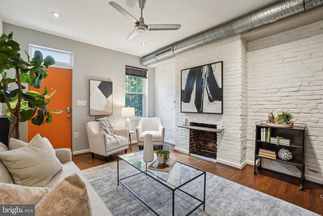 223 Parker St NE, Washington, DC 20002 - living area featuring plenty of natural light, a ceiling fan, baseboards, a fireplace, and brick wall