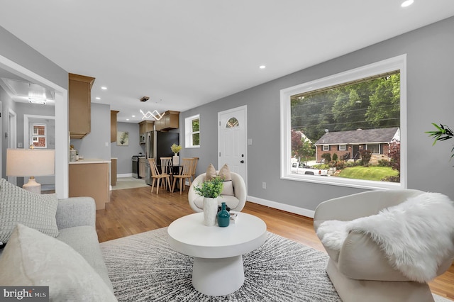 2129 Saranac St, Hyattsville, MD 20783 - living area featuring light wood-style flooring, baseboards, and recessed lighting