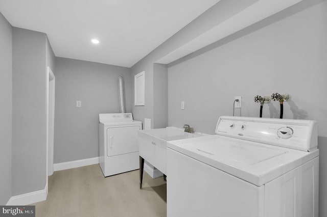 2129 Saranac St, Hyattsville, MD 20783 - washroom with independent washer and dryer, light wood-style floors, baseboards, and recessed lighting