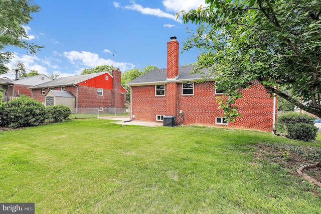 2129 Saranac St, Hyattsville, MD 20783 - rear view of property with a chimney, central AC, and brick siding