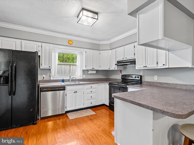 35775 Clam Ave, Frankford, DE 19945 - kitchen with black appliances, under cabinet range hood, a textured ceiling, a peninsula, and ornamental molding