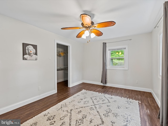 35775 Clam Ave, Frankford, DE 19945 - unfurnished bedroom featuring dark wood-style floors, baseboards, and a walk in closet