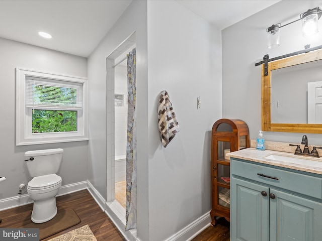 35775 Clam Ave, Frankford, DE 19945 - bathroom featuring toilet, vanity, baseboards, and wood finished floors