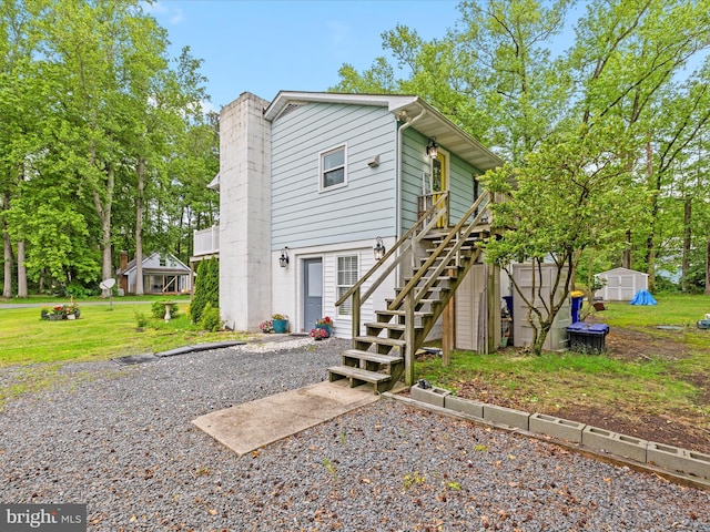 35775 Clam Ave, Frankford, DE 19945 - back of property with stairway, a lawn, and a deck