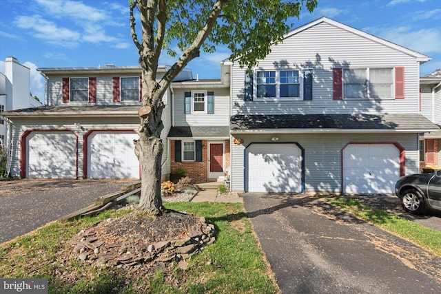 131 Red Haven Dr, North Wales, PA 19454 - view of front facade with asphalt driveway, a garage, and brick siding