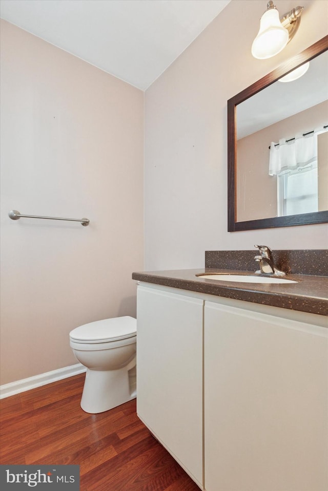 131 Red Haven Dr, North Wales, PA 19454 - bathroom with vanity, wood finished floors, toilet, and baseboards